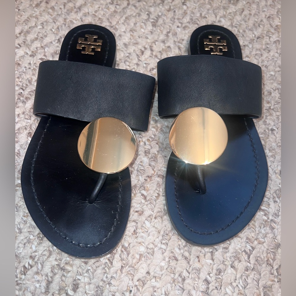 Tory Burch black and gold sandals.